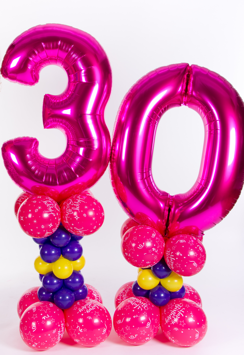 Pastel themed giant number on alternate size pillars - The Ultimate Balloon & Party Shop