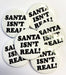 Christmas Badge - Santa Isn’t Real The Ultimate Balloon And Party Shop Cheltenham & Gloucester Balloons & Fancy Dress 