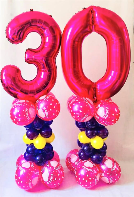 Giant number on alternate size pillars - The Ultimate Balloon & Party Shop