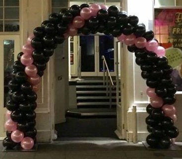 Black & Gold Spiral Arch with Letter Balloons - The Ultimate Balloon & Party Shop